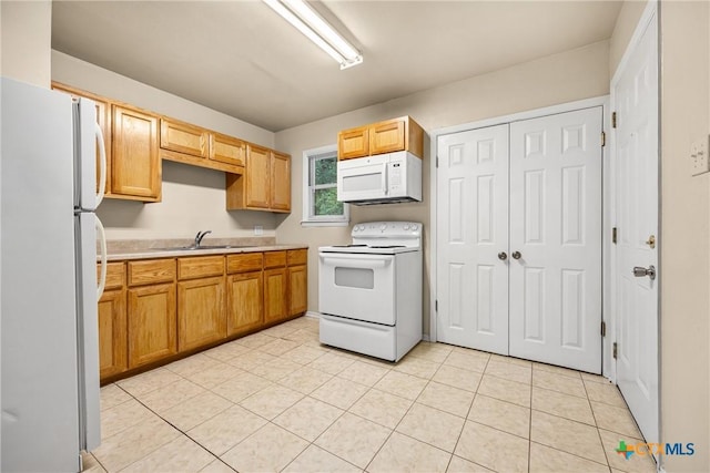 804 Little St, Copperas Cove, TX 76522 - kitchen featuring white appliances, light countertops, and light tile patterned flooring