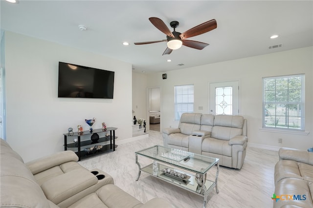 living room featuring ceiling fan