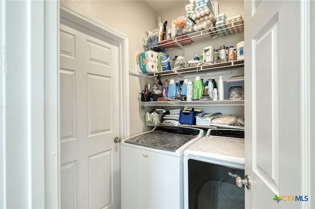 washroom with washing machine and dryer