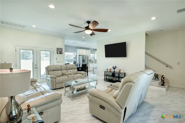 living room with french doors and ceiling fan