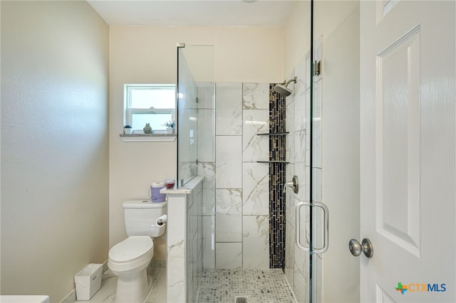 bathroom featuring walk in shower and toilet