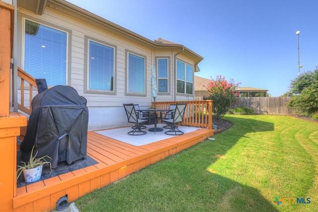 3214 Roan St, New Braunfels, TX 78130 - wooden terrace with a fenced backyard, outdoor dining area, and grilling area