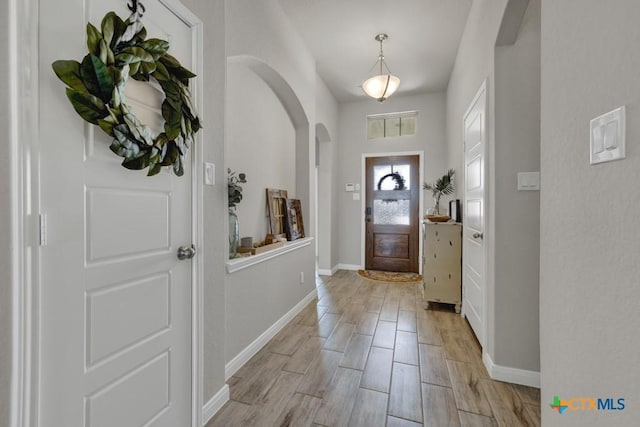 3214 Roan St, New Braunfels, TX 78130 - entryway with arched walkways and light wood-style floors