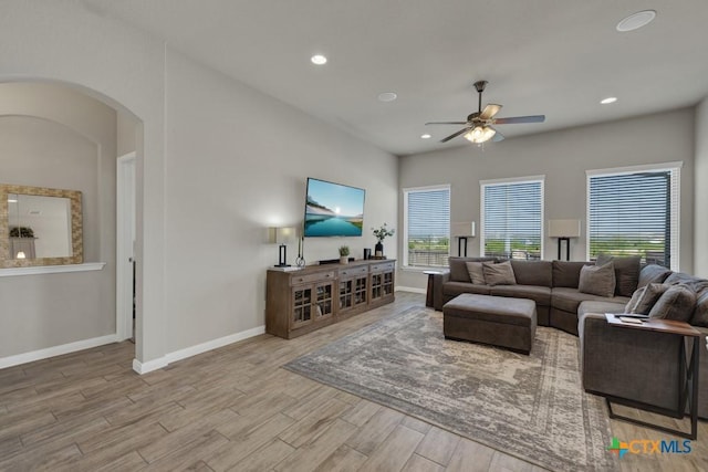 3214 Roan St, New Braunfels, TX 78130 - living room with a ceiling fan, arched walkways, wood finished floors, and recessed lighting