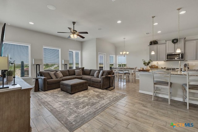 3214 Roan St, New Braunfels, TX 78130 - living room with ceiling fan, recessed lighting, light wood finished floors, and a chandelier