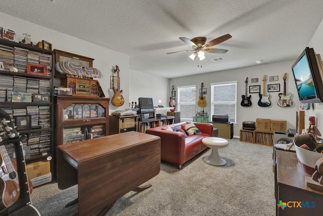3214 Roan St, New Braunfels, TX 78130 - living area featuring carpet floors, a ceiling fan, a textured ceiling, and an office area
