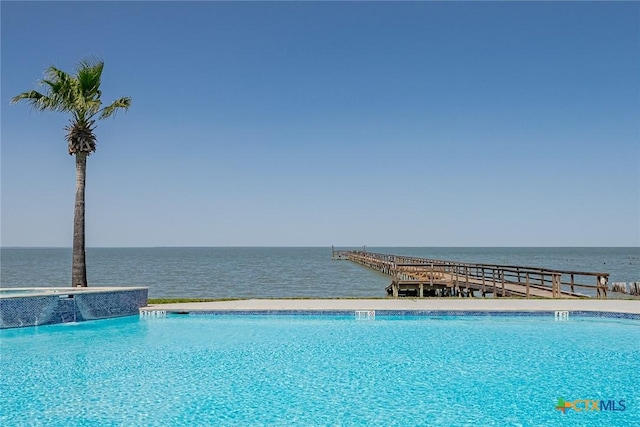 view of pool featuring a water view