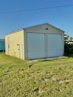 garage with a lawn