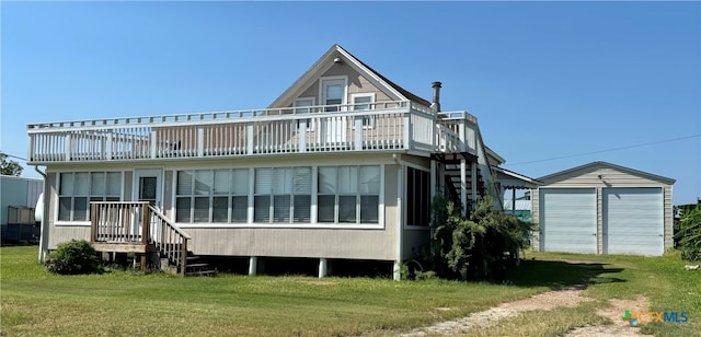 back of house featuring a shed, a wooden deck, and a yard