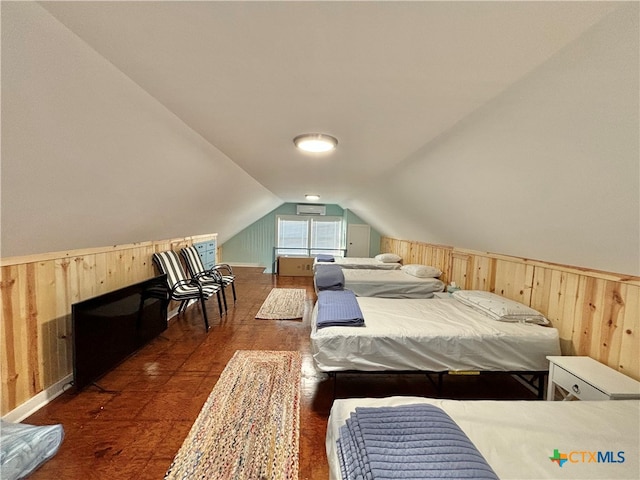 bedroom featuring wood walls, dark hardwood / wood-style flooring, and lofted ceiling