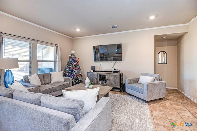 living room featuring light tile patterned flooring and ornamental molding