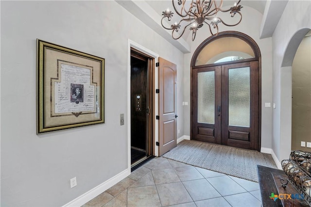 tiled foyer entrance with french doors