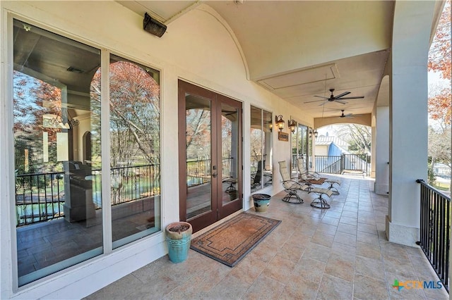 view of patio / terrace with french doors and ceiling fan