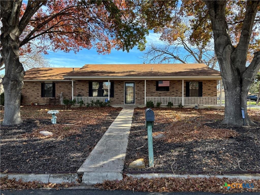 ranch-style home with covered porch