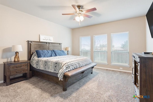 bedroom featuring light colored carpet and ceiling fan