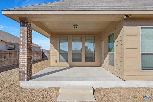 property entrance with a patio