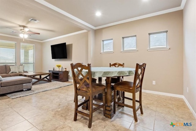 dining space featuring light tile patterned floors, crown molding, and ceiling fan