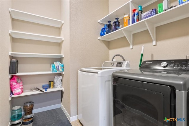 washroom featuring washing machine and dryer