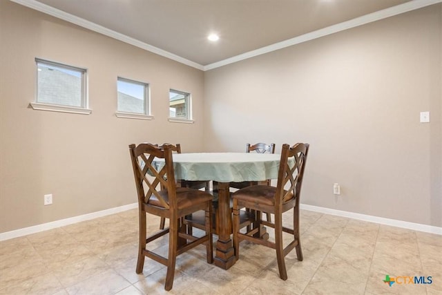 dining area featuring crown molding