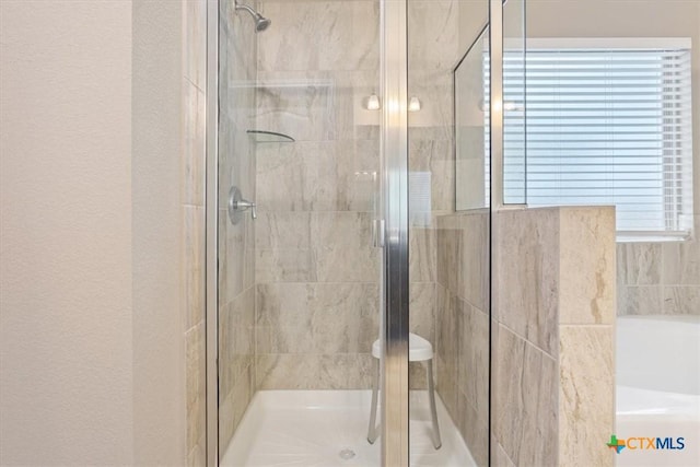 bathroom featuring an enclosed shower