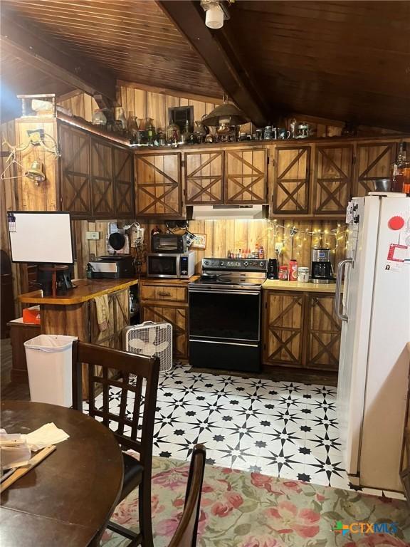 304 Kegley St, Belton, TX 76513 - kitchen featuring stainless steel microwave, black / electric stove, lofted ceiling with beams, freestanding refrigerator, and wood ceiling