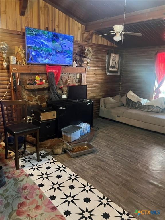 304 Kegley St, Belton, TX 76513 - living room featuring wood walls, a ceiling fan, wooden ceiling, and wood finished floors