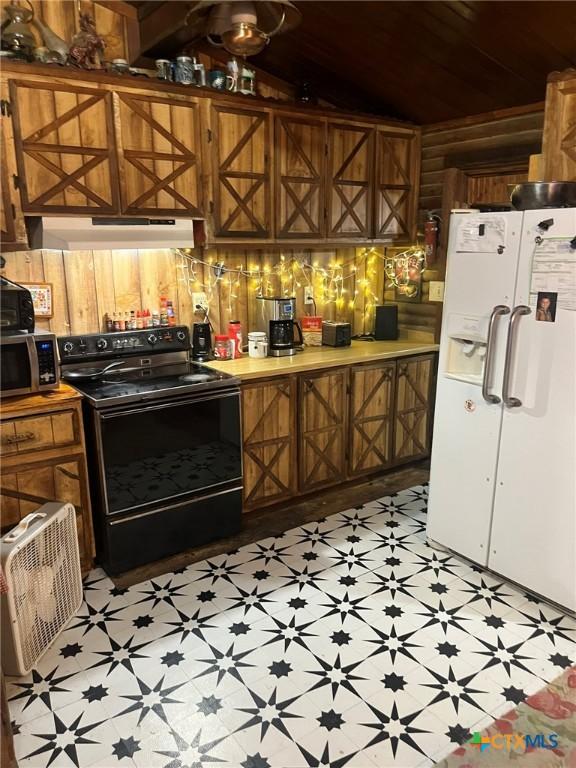 304 Kegley St, Belton, TX 76513 - kitchen featuring under cabinet range hood, white fridge with ice dispenser, black range with electric cooktop, and light floors