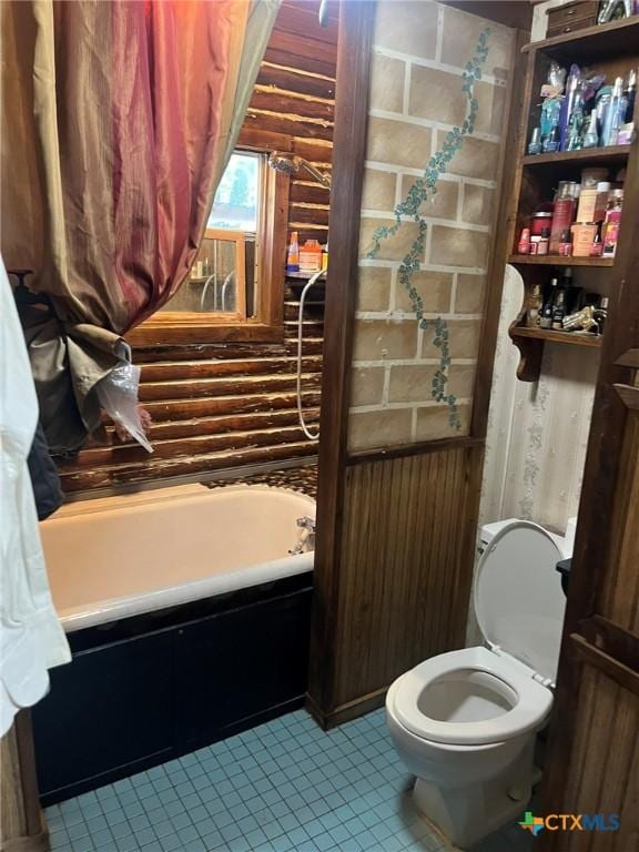 304 Kegley St, Belton, TX 76513 - full bath with tile patterned flooring, toilet, and a washtub