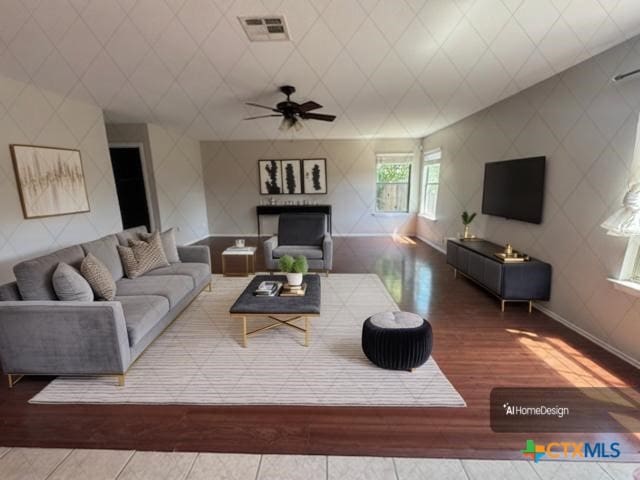 201 Windridge Dr, Lockhart, TX 78644 - living area with visible vents, wood finished floors, and a ceiling fan