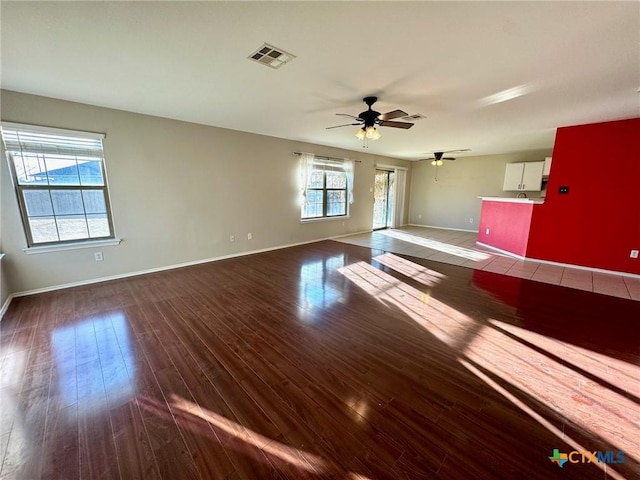 empty room with wood-type flooring and ceiling fan