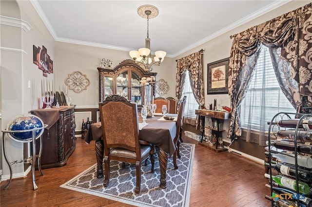 100 Rustler Cir, Harker Heights, TX 76548 - dining room with a chandelier, healthy amount of natural light, crown molding, wood finished floors, and baseboards