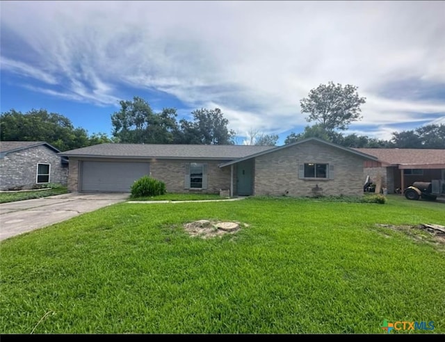 single story home featuring a garage and a front yard