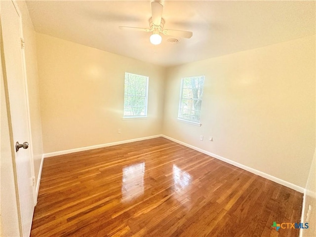 909 S 23rd St, Copperas Cove, TX 76522 - empty room with wood finished floors, ceiling fan, and baseboards