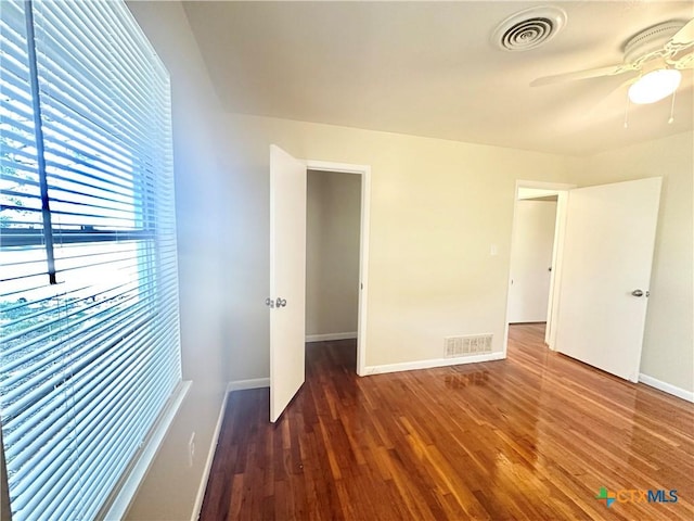 909 S 23rd St, Copperas Cove, TX 76522 - unfurnished bedroom with wood finished floors, baseboards, and a ceiling fan