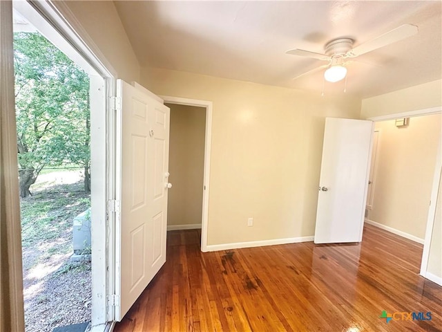 909 S 23rd St, Copperas Cove, TX 76522 - unfurnished bedroom with baseboards, hardwood / wood-style flooring, and a ceiling fan