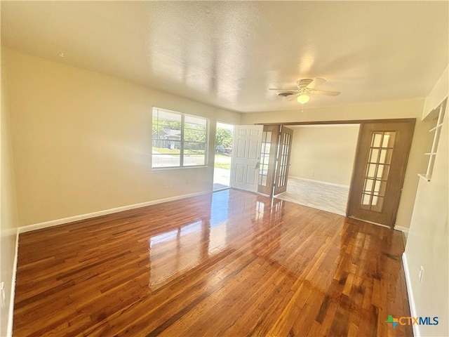 909 S 23rd St, Copperas Cove, TX 76522 - spare room featuring wood finished floors, baseboards, and a ceiling fan
