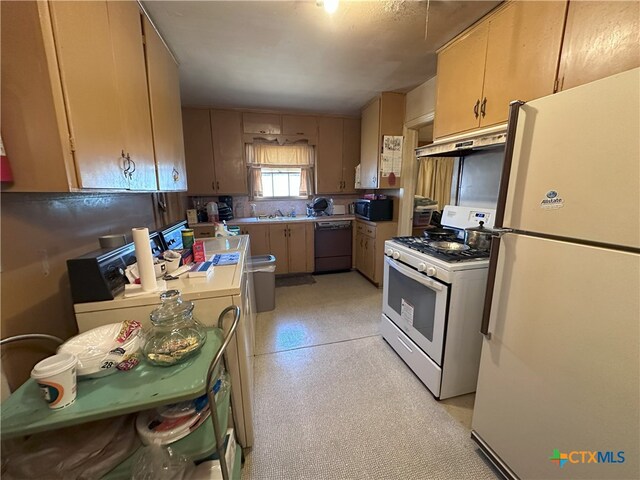 kitchen with black appliances, sink, and light brown cabinetry