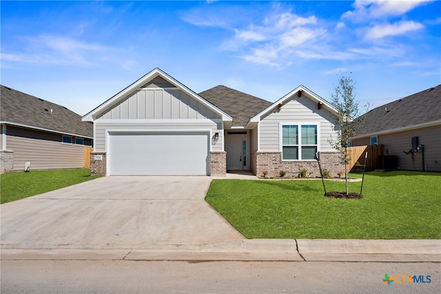 craftsman-style home featuring a front yard and a garage