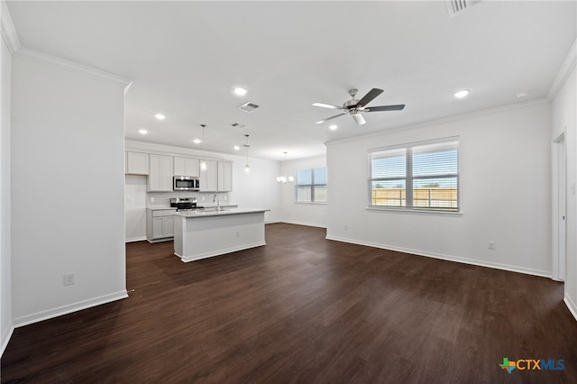 unfurnished living room with dark hardwood / wood-style flooring, ceiling fan, ornamental molding, and sink