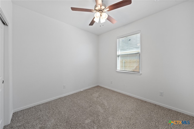 unfurnished room with carpet flooring and ceiling fan