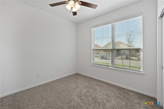 empty room with carpet and ceiling fan