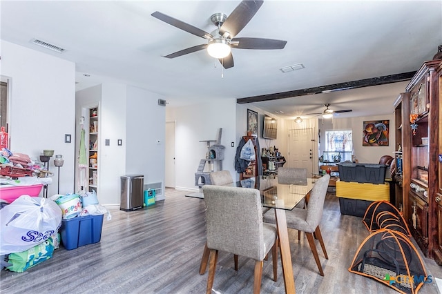 dining room featuring ceiling fan and dark hardwood / wood-style flooring