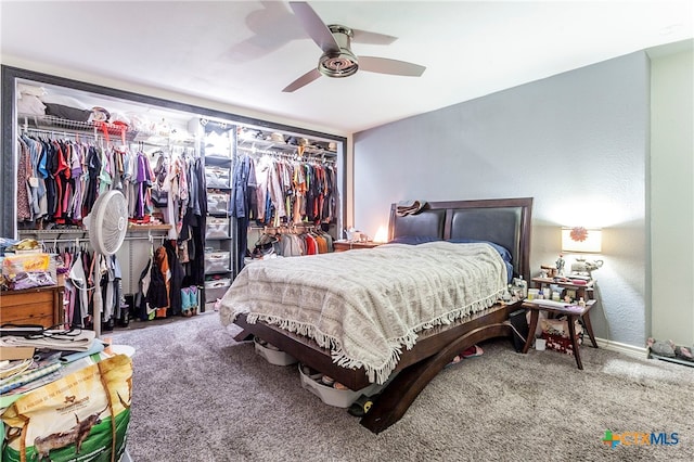 bedroom with carpet floors, ceiling fan, and a closet