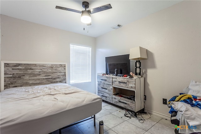 bedroom with light tile patterned flooring and ceiling fan