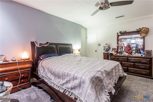 bedroom featuring ceiling fan and carpet flooring