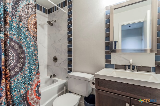 full bathroom featuring shower / bath combo, vanity, and toilet