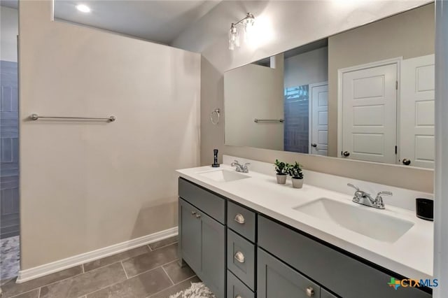 213 Flint Rock Ct, Victoria, TX 77904 - bathroom featuring double vanity and tile patterned flooring