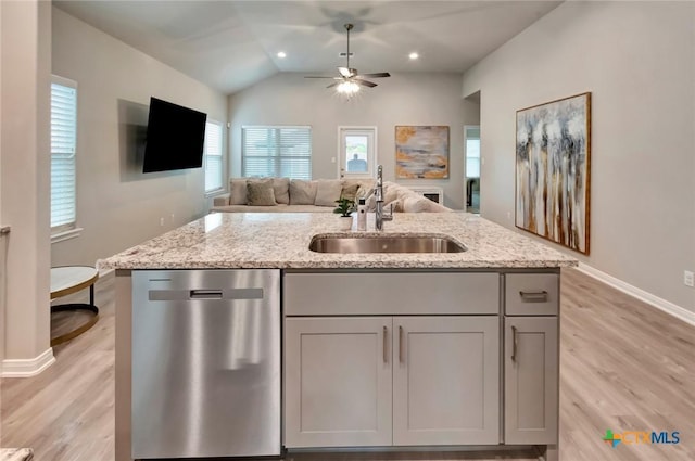 213 Flint Rock Ct, Victoria, TX 77904 - kitchen with dishwasher, open floor plan, gray cabinetry, light wood-style flooring, and lofted ceiling