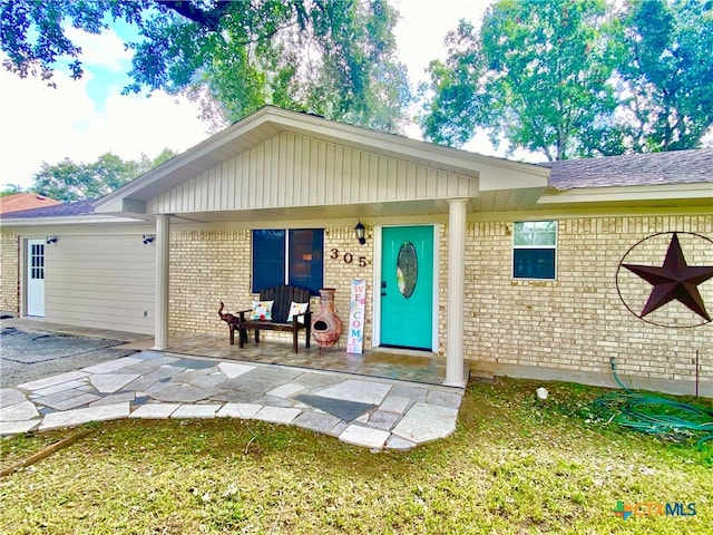 single story home featuring a patio