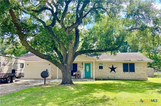 ranch-style home with a front lawn